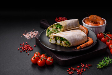 Delicious fresh roll with shrimps, tomatoes, lettuce and cucumber in pita bread