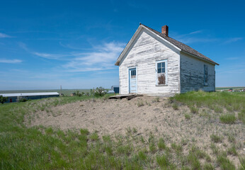 Abandoned white clapboard building in Galata, Montana, USA 