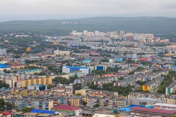 Fototapeta na wymiar Top view of the cityscape. Residential urban areas. Aerial view of the buildings and streets of the city. Urban landscape. City of Petropavlovsk-Kamchatsky, Kamchatka Territory, Far East of Russia.