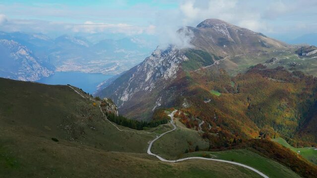 aerial video view of lake Garda and clouds on Monte Baldo mountains in Italy
