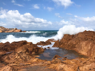 Crashing waves on rocks in Menorca, Spain