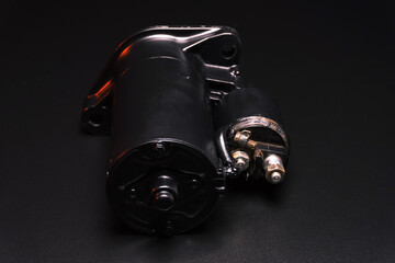 old black starter for starting the engine in a car after repair