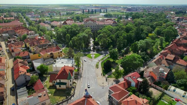 Aerial drone view of Oradea, Romania. View of the city, museum and multiple old buildings made in classic style around, greenery