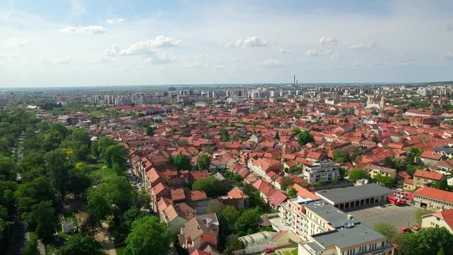 Aerial drone view of Oradea, Romania. Cityscape with multiple old buildings made in classic style, Unirii Square, greenery