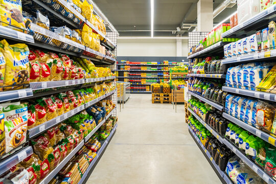 Wide aisles of a supermarket with selective focus. April 13, 2023 Balti, Moldova. Illustrative editorial.