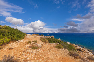 Beautiful landscape view of island on blue sea water merging with cloudless sky on background....