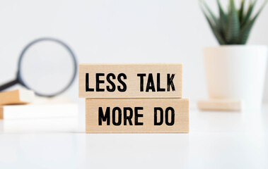 Less Talk more Do, written on a sticky note.
