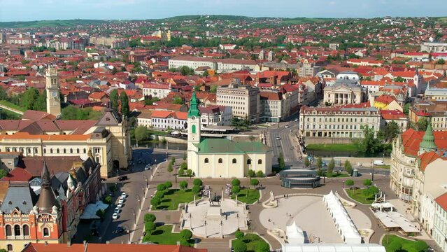 Areal drone view of the Unirii Square in Oradea downtown, Romania. King Ferdinand I statue, Saint Ladislaus Church, Town Hall and other historical buildings