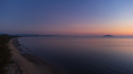 Sunrise sky over horizon in morning with colorful clouds. Orange sunlight.