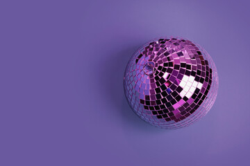 Shiny disco ball on violet background, top view. Space for text