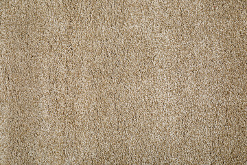 Stylish soft beige carpet as background, top view