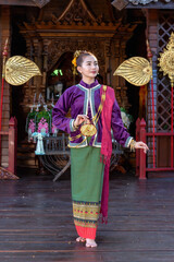 Fototapeta premium Thai woman dressed in traditional Northern Thailand culture costume.