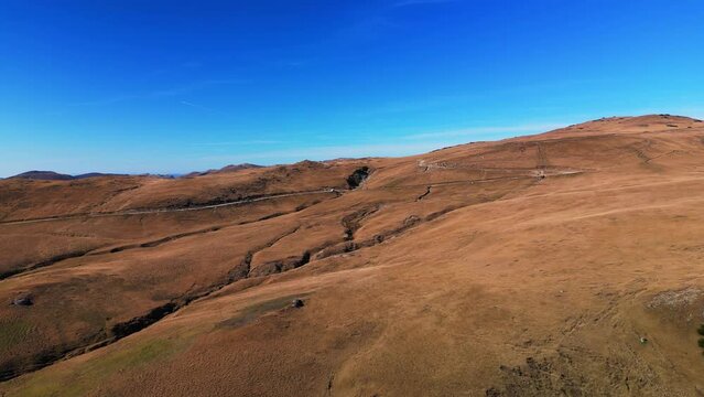 pietra arsa mountains prahova valley Romania against blue sky aerial footage 