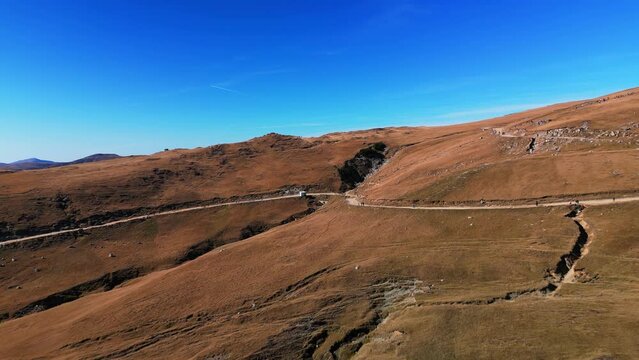 drone fly above rock formation mountains in pietra arsa mountains prahova valley Romania