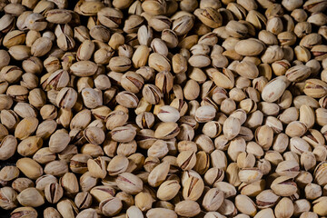 Pistachios background. Pistachio nuts close up.