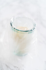 Homemade royal icing for decorating heart-shaped sugar cookies