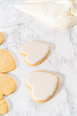 Heart-shaped sugar cookies with royal icing