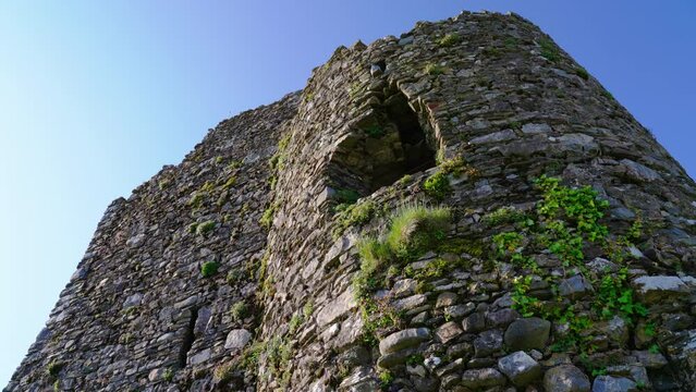 Low angle of the historic Tenby Castle watchtower and the clear blue sky, Tenby, Wales, UK