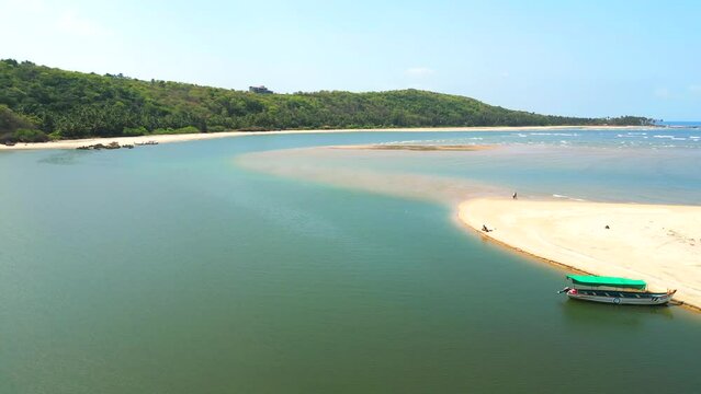 Devbag Beach drone moving closer to river in Malvan