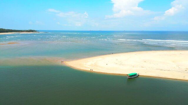 Devbag beach drone moving closeup to wide from river in malvan