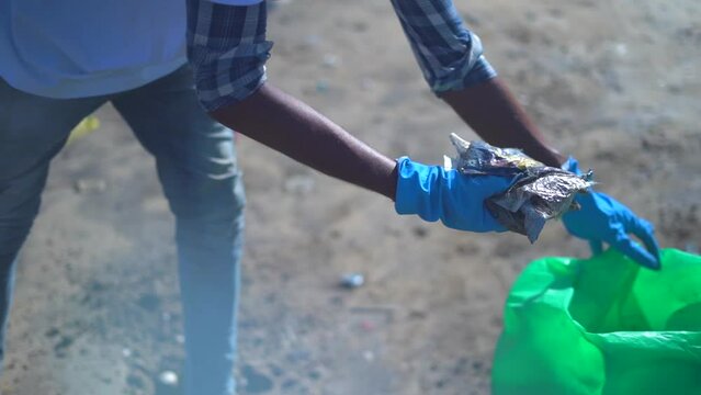 he pik the garbage in juhu beach closeup view in mumbai