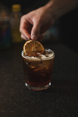 hand holding a cup of cold brew