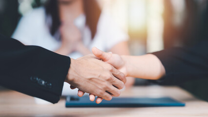 Businessmen shaking hands to indicate a business deal ,successful contract management of company...