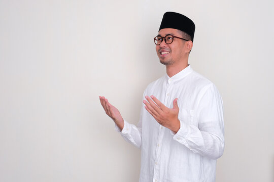 Side View Of Moslem Man Smiling And Looking Up When Praying