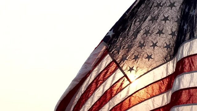 Juneteenth Freedom Day, June 19. American USA flag waving in the wind against sun nature outdoor background. Concept Juneteenth, Freedom, 4th of July, Memorial, Independence Day, Veterans, Day