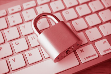 Padlock on computer keyboard background in monochrome tone. Encryption username password in online internet website, cyber security, privacy data information protection, firewall concept.