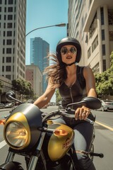 Fototapeta na wymiar Pretty woman riding a motorcycle in the street of Los Angeles