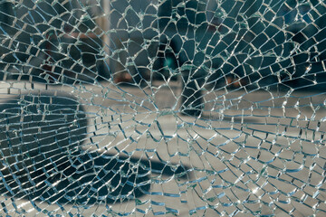 Cracked Shattered Glass Background with Spider Web Pattern.