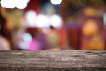 Empty wooden table in front of abstract blurred background of coffee shop . can be used for display or montage your products.Mock up for display of product