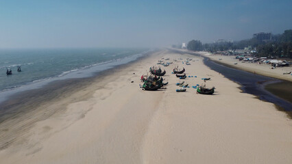 Drone shot of lined up traditional bangladeshi wooden handcrafted fishing boats called Sampan at...