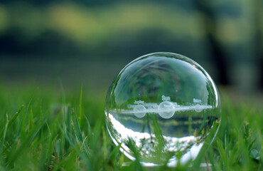 Nature photography of crystal ball with solar system in it, space, future environment and ESG concept