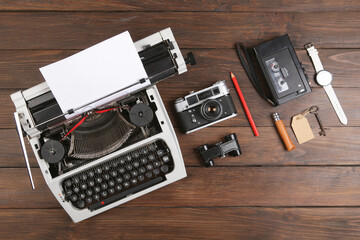 Journalist or private detective workplace - typewriter, camera, hat, recorder and other stuff, flat view above