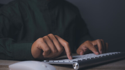 Businessman using keyboard computer working on office table. copy space.