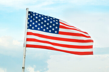 American Flag Wave CloseUp in blue sky background, United States Of America Flat Flags