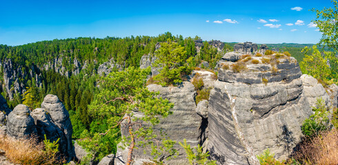 Panoramic View over Bastei sandstone pillars and rockformations in the national park Saxon...
