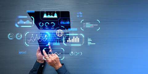 Businessman working with phone and laptop, key performance indicators and analysis