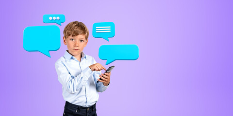Serious little boy using smartphone with speech bubbles