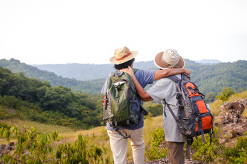 Portrait of two Asian elderly women hiking Nature tourism. Retirement travel. sports.