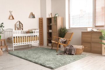 Interior of children's bedroom with crib, shelves and toys