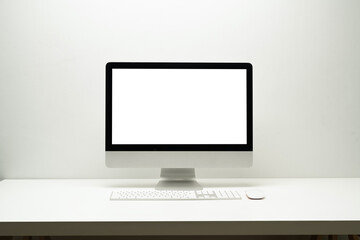 Front view of bank screen computer, wireless keyboard and mouse on white table. Blank screen for your webpage or advertise text