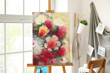 Drawing easel with beautiful picture in artist's workshop