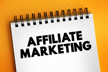Affiliate Marketing - earning a commission by promoting a product or service made by another retailer or advertiser, text concept on notepad