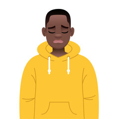 Sad African boy in a yellow hoodie. A black young guy with glasses is sad.
