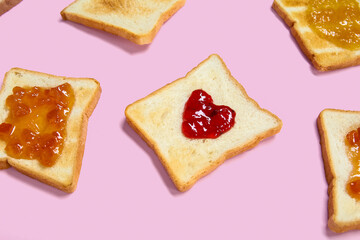 Obraz na płótnie Canvas Toasts with different jams on pink background, closeup
