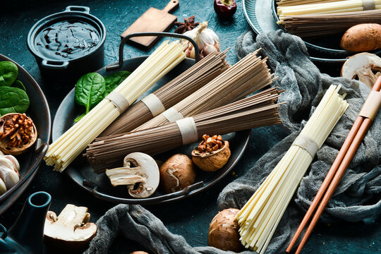 Japanese raw noodles: Udon, Buckwheat soba pasta. Top view. Healthy food.
