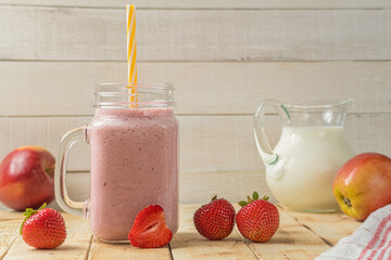 Fresh milkshake with strawberries. A glass of fresh strawberry milkshake